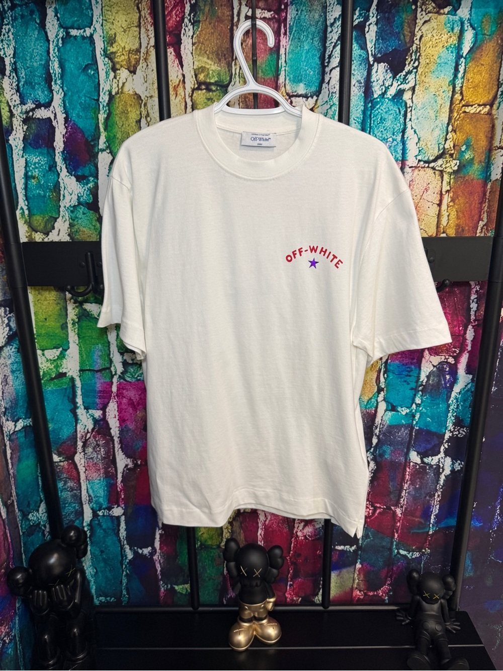 Off-White Cream Short-Sleeve Logo Tee with Red Branding and Purple Star